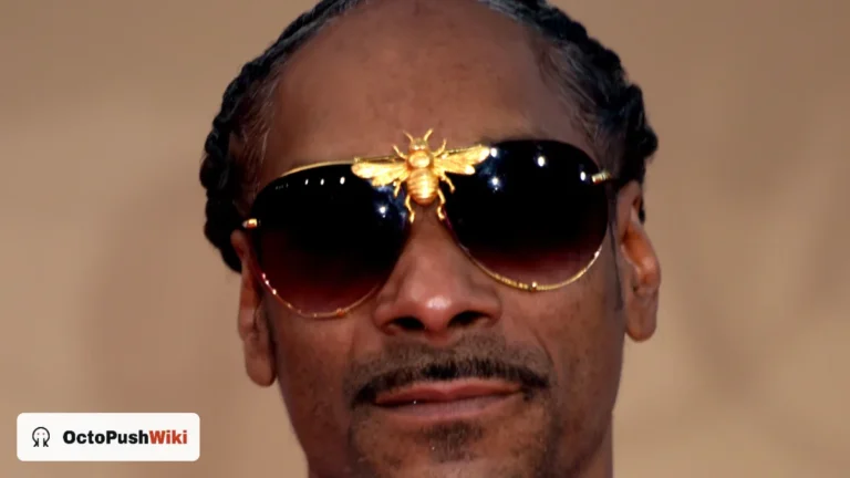 Snoop Dogg wearing sunglasses and a gold chain in 2019, featured in this Snoop Dogg net worth profile
